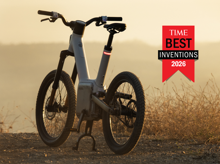 The logo for TIME's Best Inventions of 2026 next to ALSO's TM-B e-bike propped up by its kickstand.